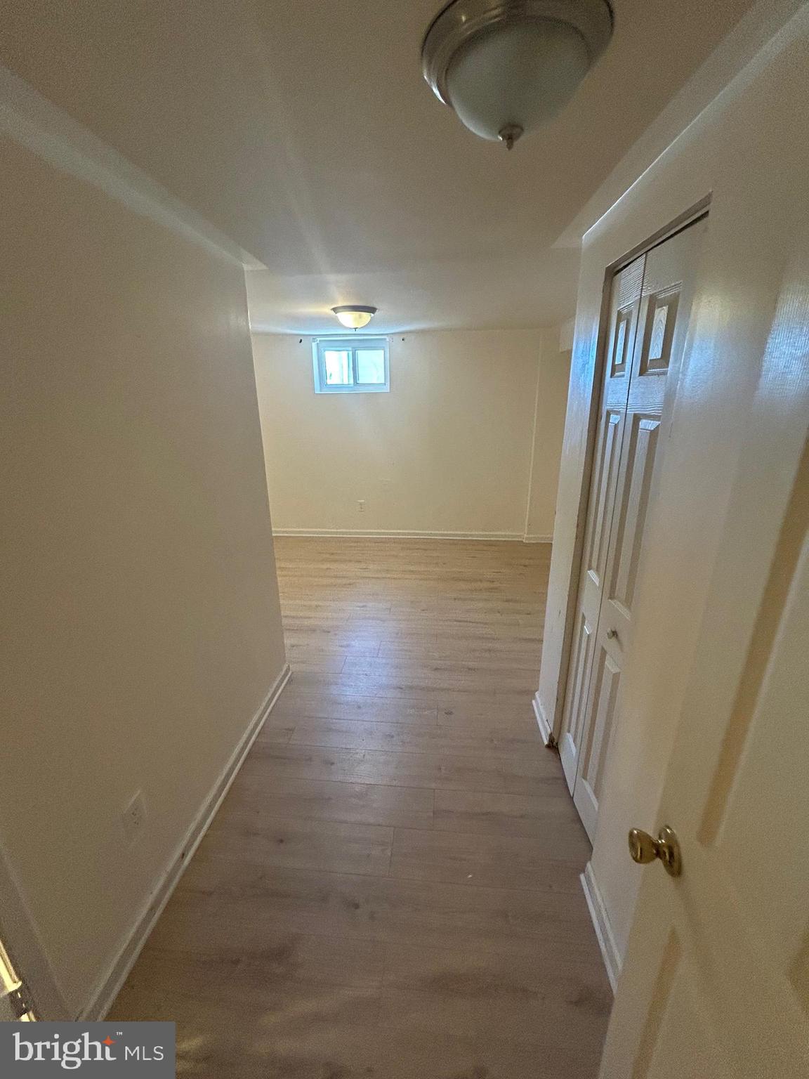 7208 Powhatan Street Lanham, MD 20706 - Photo 20 of 28 a view of a livingroom with wooden floor and staircase