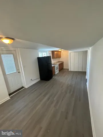 a view of a livingroom with wooden floor
