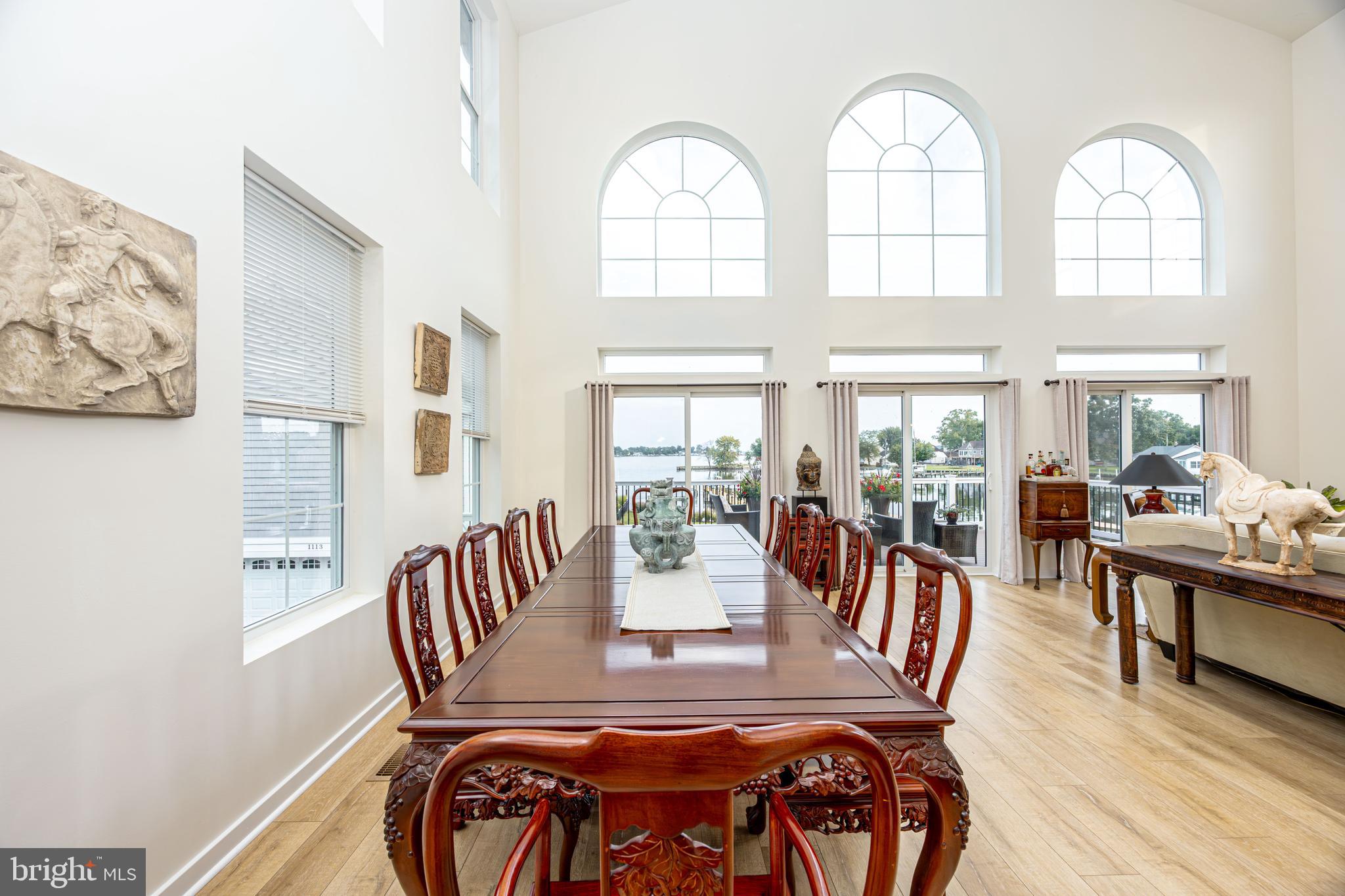 1117 Chester Road Middle River, MD 21220 - Photo 21 of 95 a view of a dining room with furniture a chandelier and wooden floor