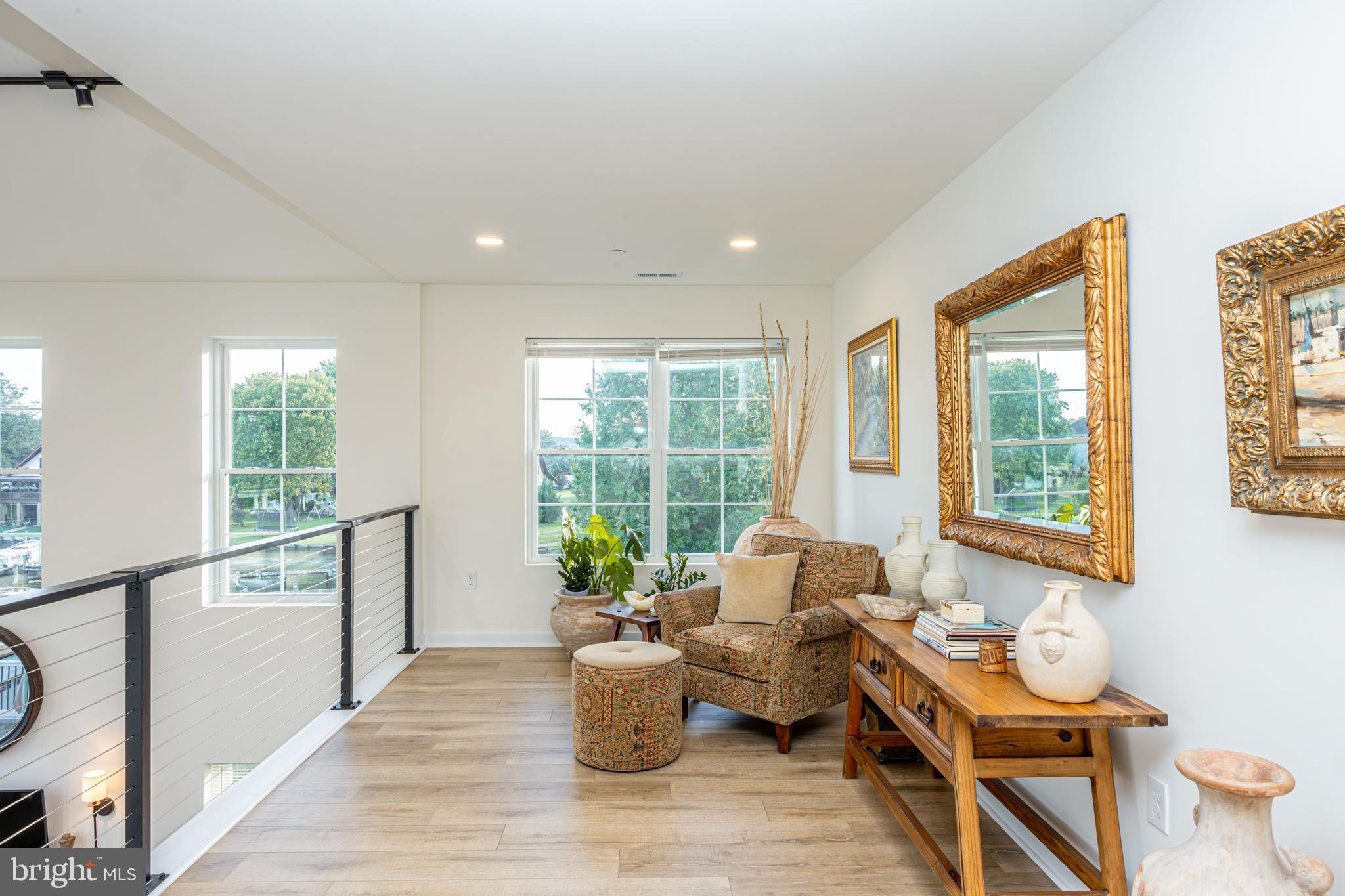 1117 Chester Road Middle River, MD 21220 - Photo 41 of 95 a living room with furniture and floor to ceiling windows