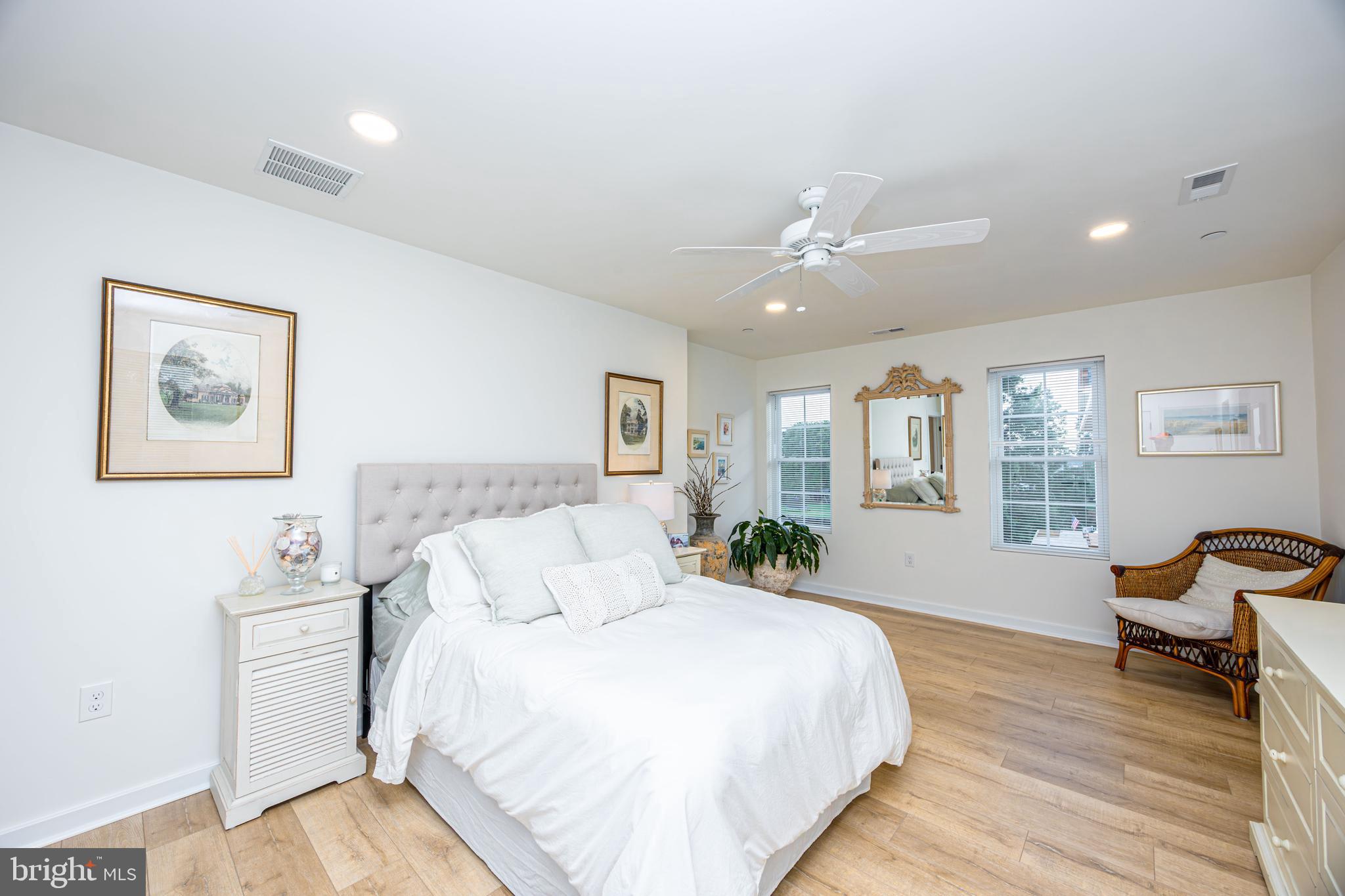 1117 Chester Road Middle River, MD 21220 - Photo 52 of 95 a spacious bedroom with a bed and wooden floor