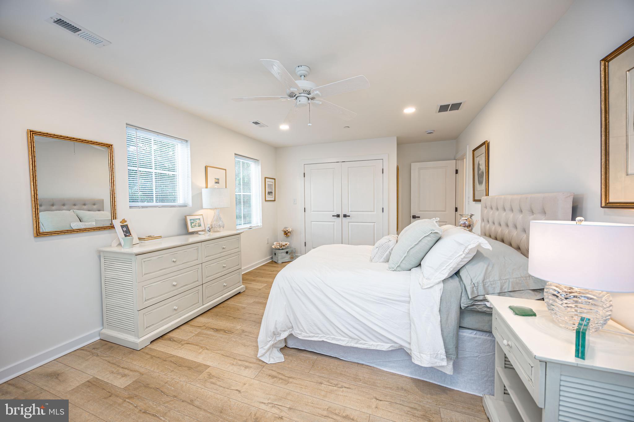 1117 Chester Road Middle River, MD 21220 - Photo 54 of 95 a spacious bedroom with a bed and a couch