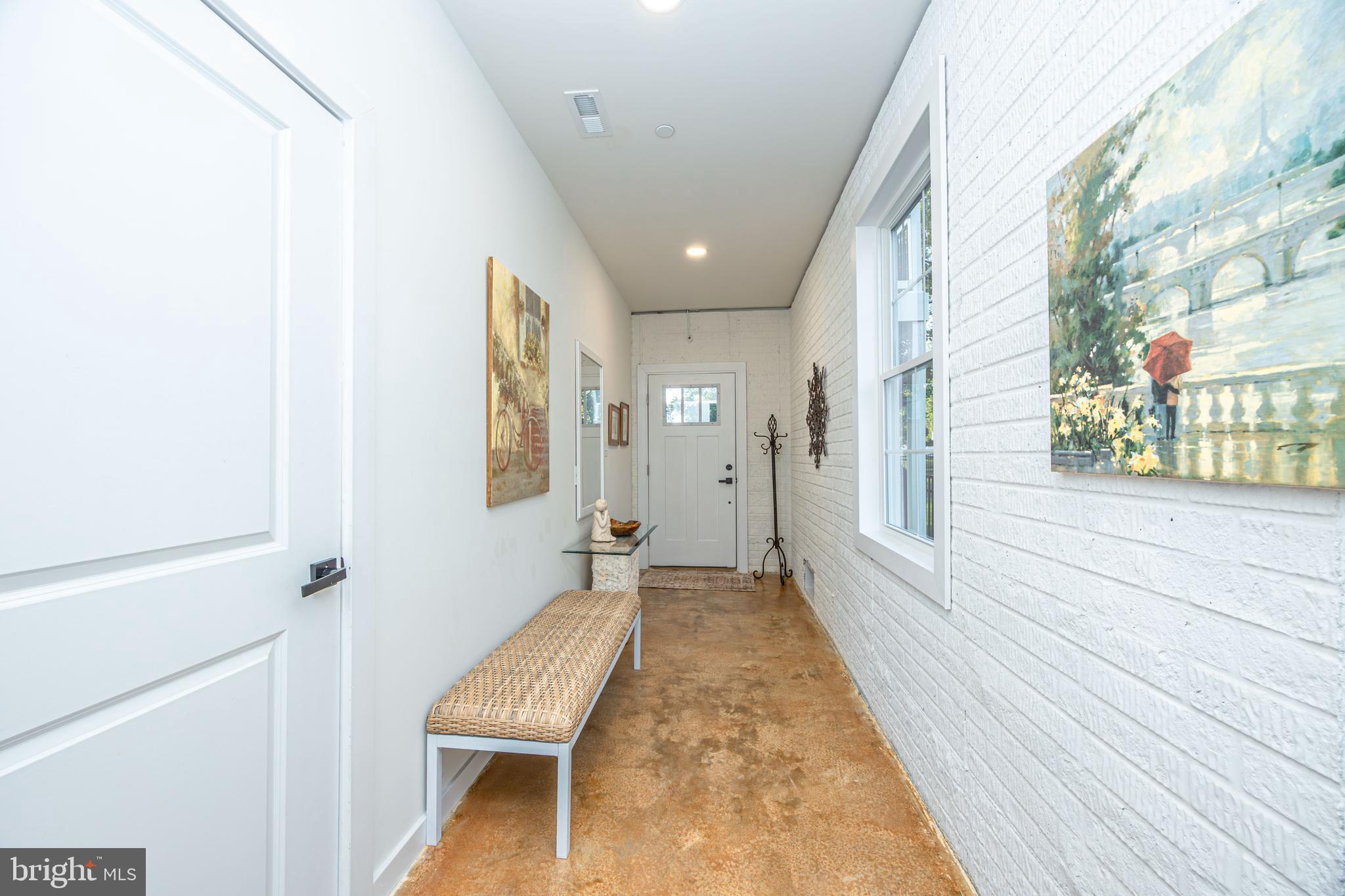 1117 Chester Road Middle River, MD 21220 - Photo 64 of 95 a view of a hallway with wooden floor and chair