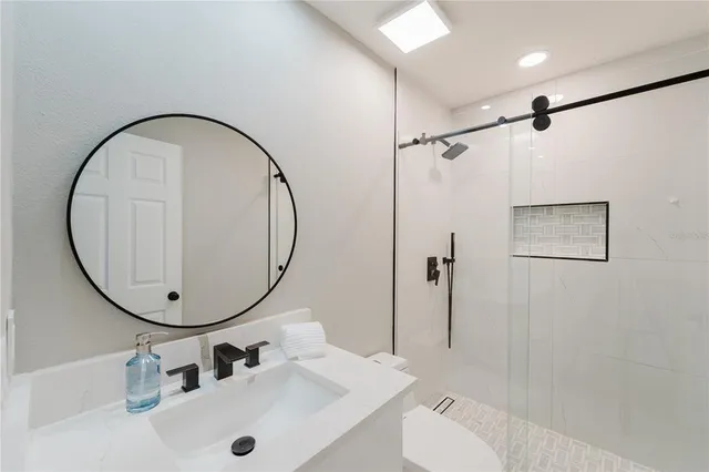 a bathroom with a sink and a mirror