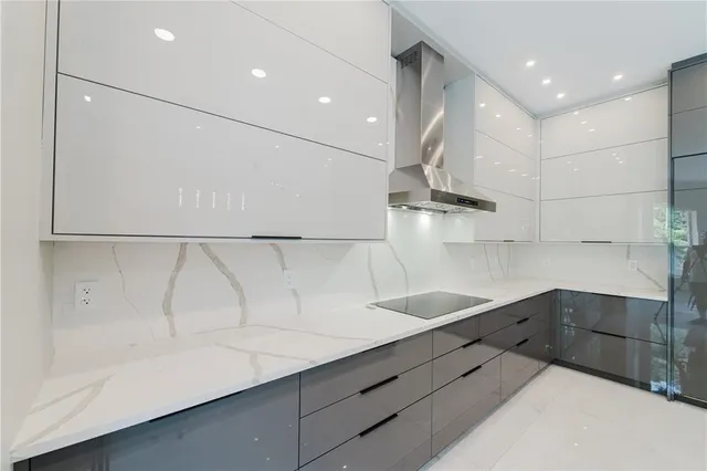 a kitchen with a sink a counter space and stainless steel appliances