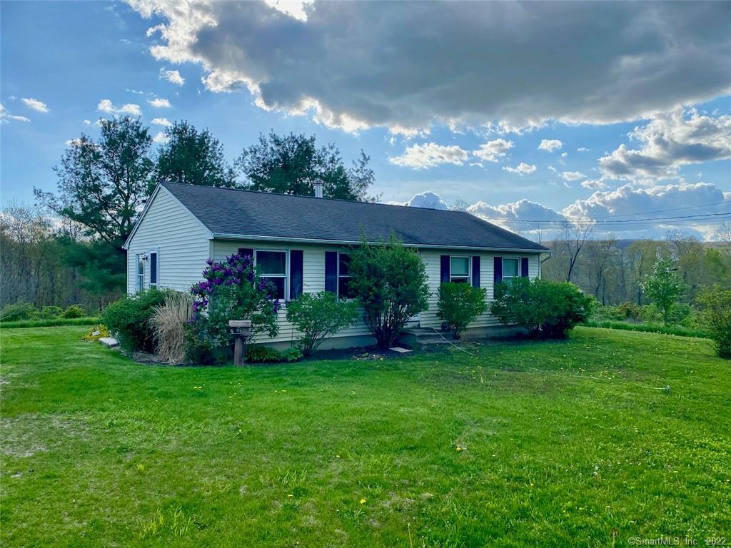 96 Beardsley Road Kent, CT 06785 - Photo 1 of 1 a front view of a house with garden and yard