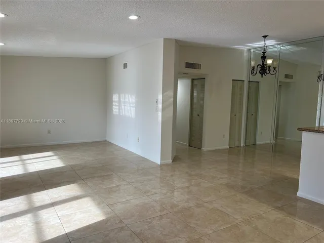 an empty room with a bathroom