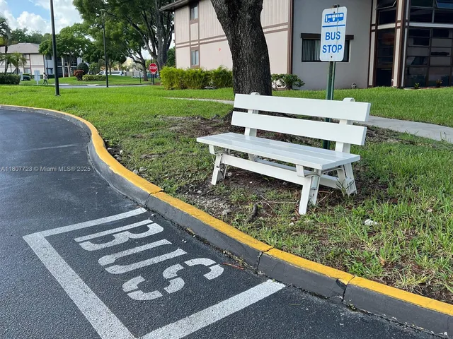 a view of a bench in a park