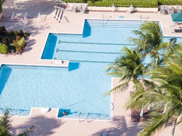a view of swimming pool from a balcony