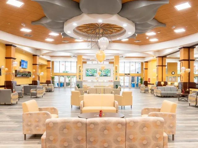 a backyard of a house with wooden floor and fence