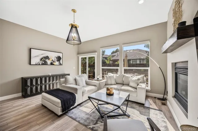 a living room with furniture rug and window