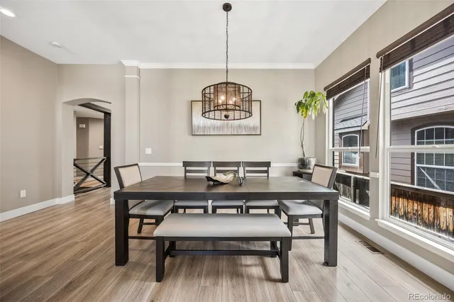 a view of a dining room with furniture window and wooden floor