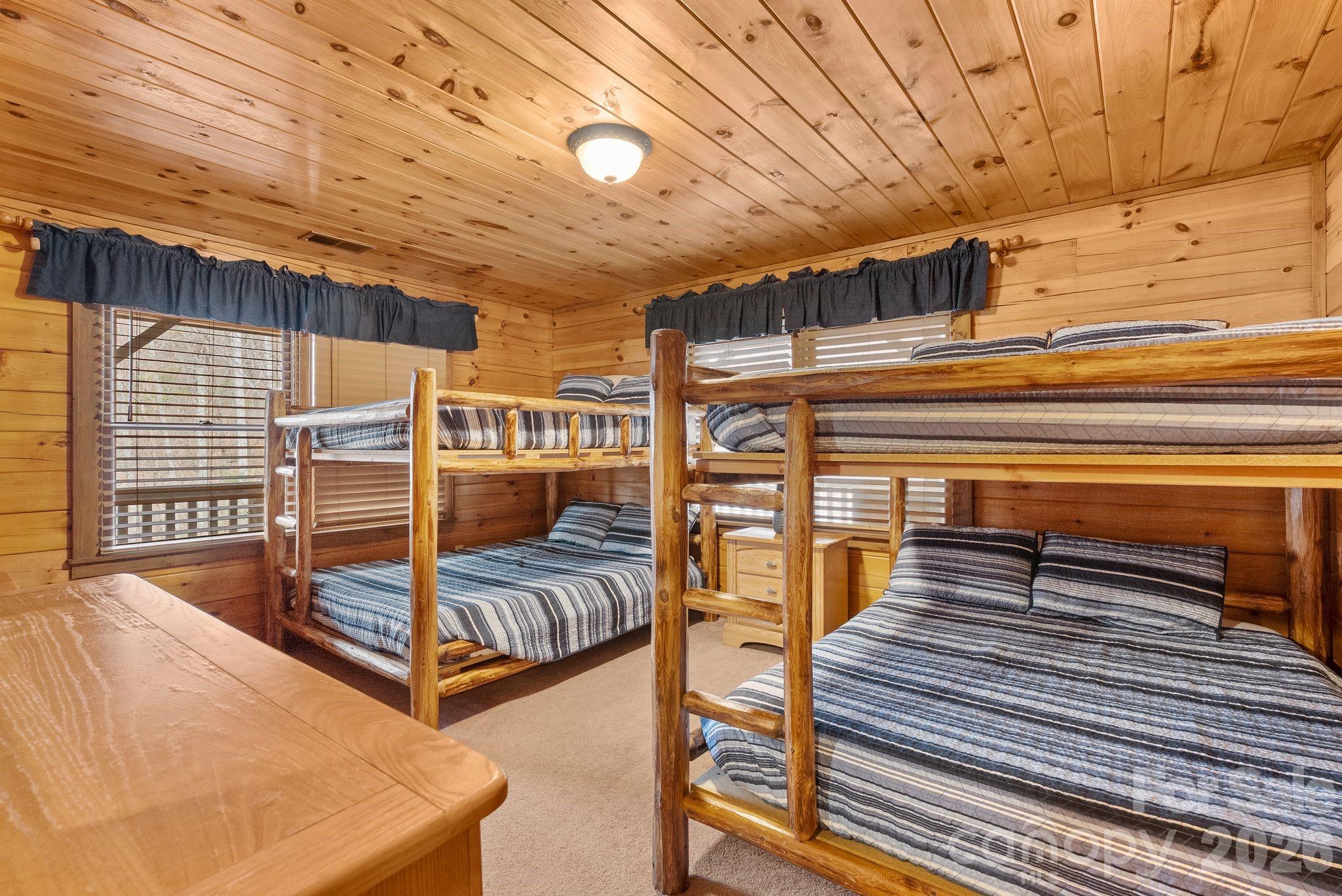 264 Moonbeam Lane Clyde, NC 28721 - Photo 15 of 46 a view of a room with wooden floor