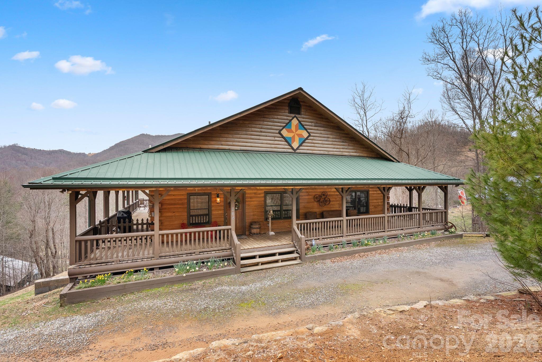 264 Moonbeam Lane Clyde, NC 28721 - Photo 2 of 46 a view of a house with wooden fence