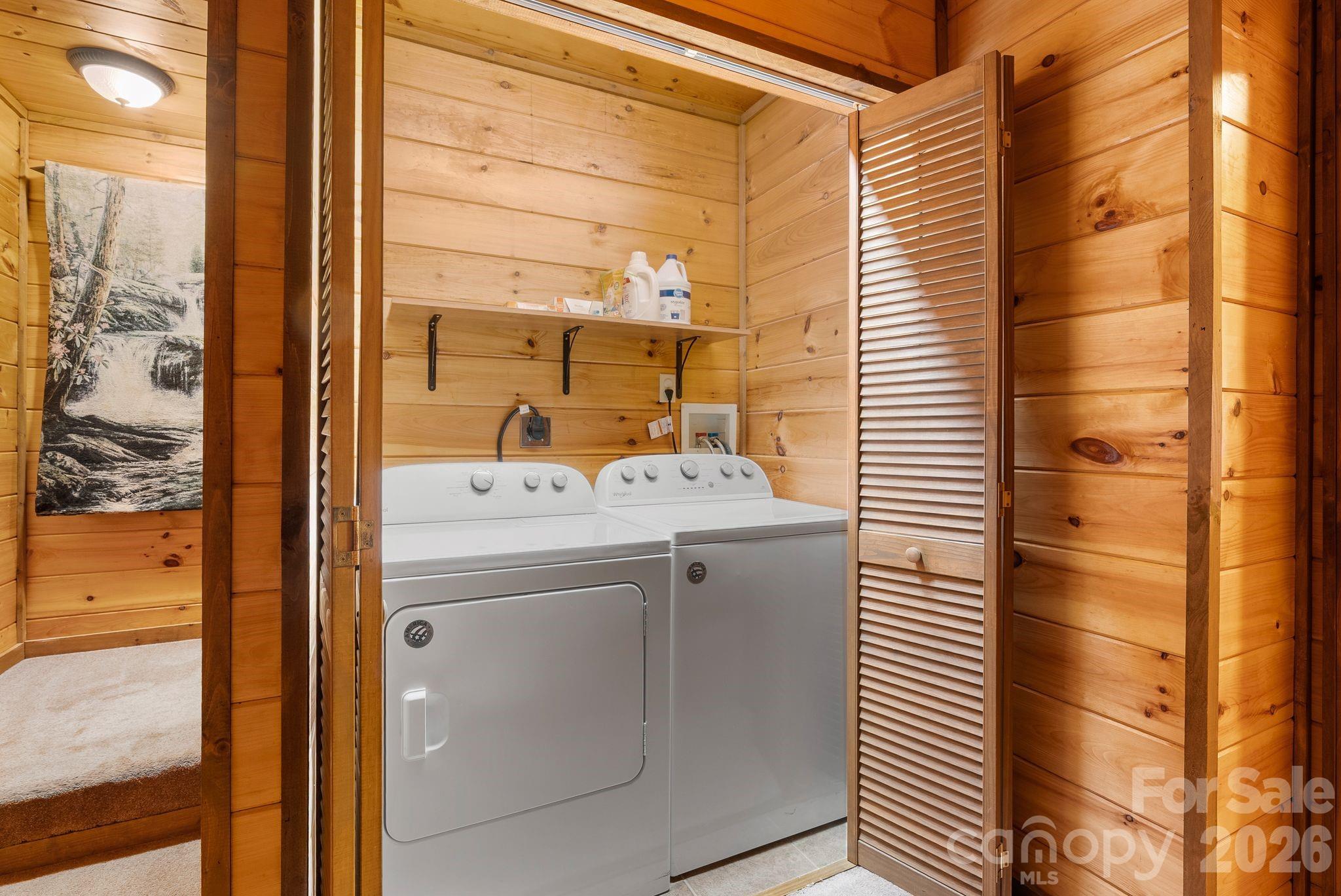 264 Moonbeam Lane Clyde, NC 28721 - Photo 22 of 46 a bathroom with a sink and a mirror