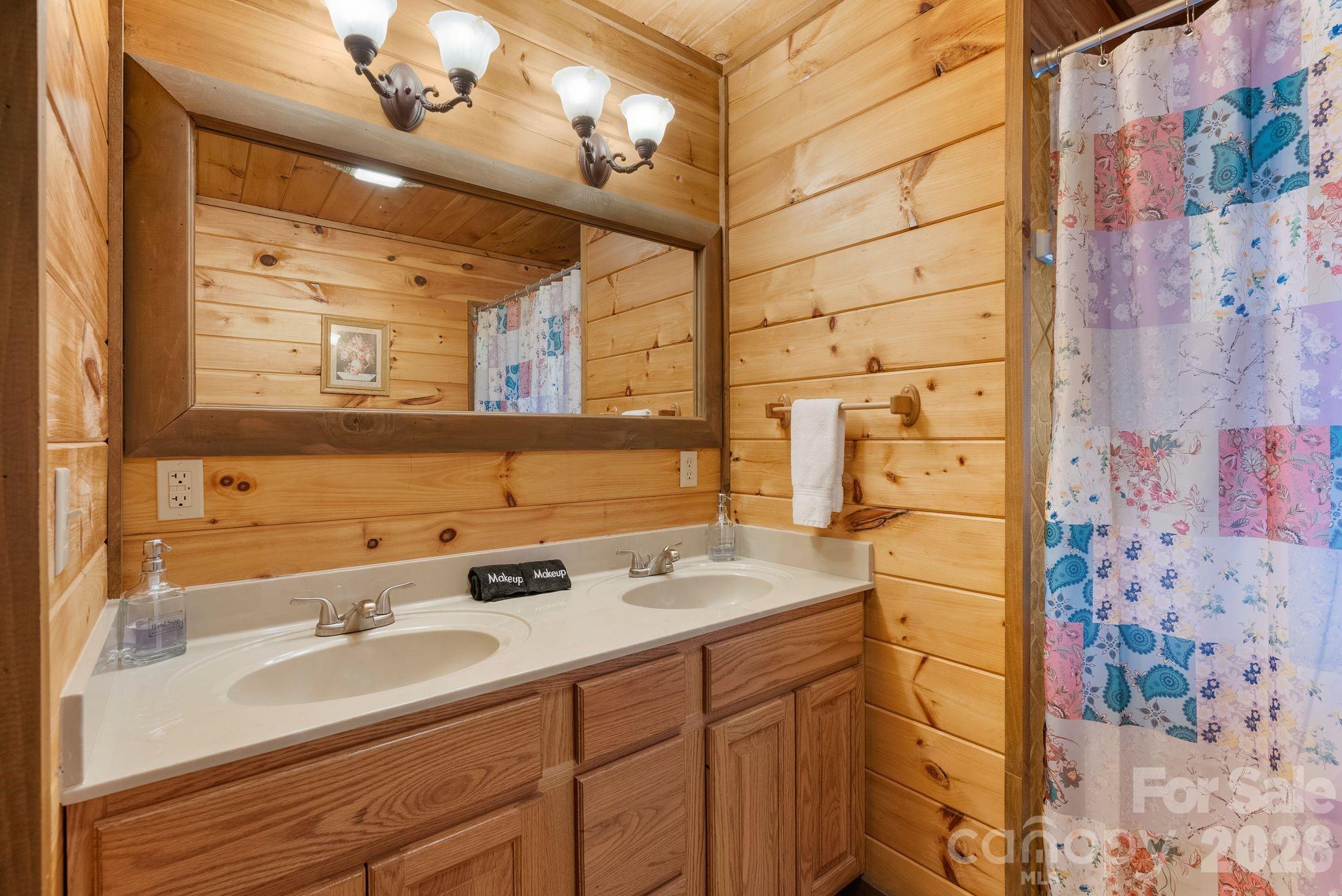 264 Moonbeam Lane Clyde, NC 28721 - Photo 30 of 46 a bathroom with a sink and a mirror