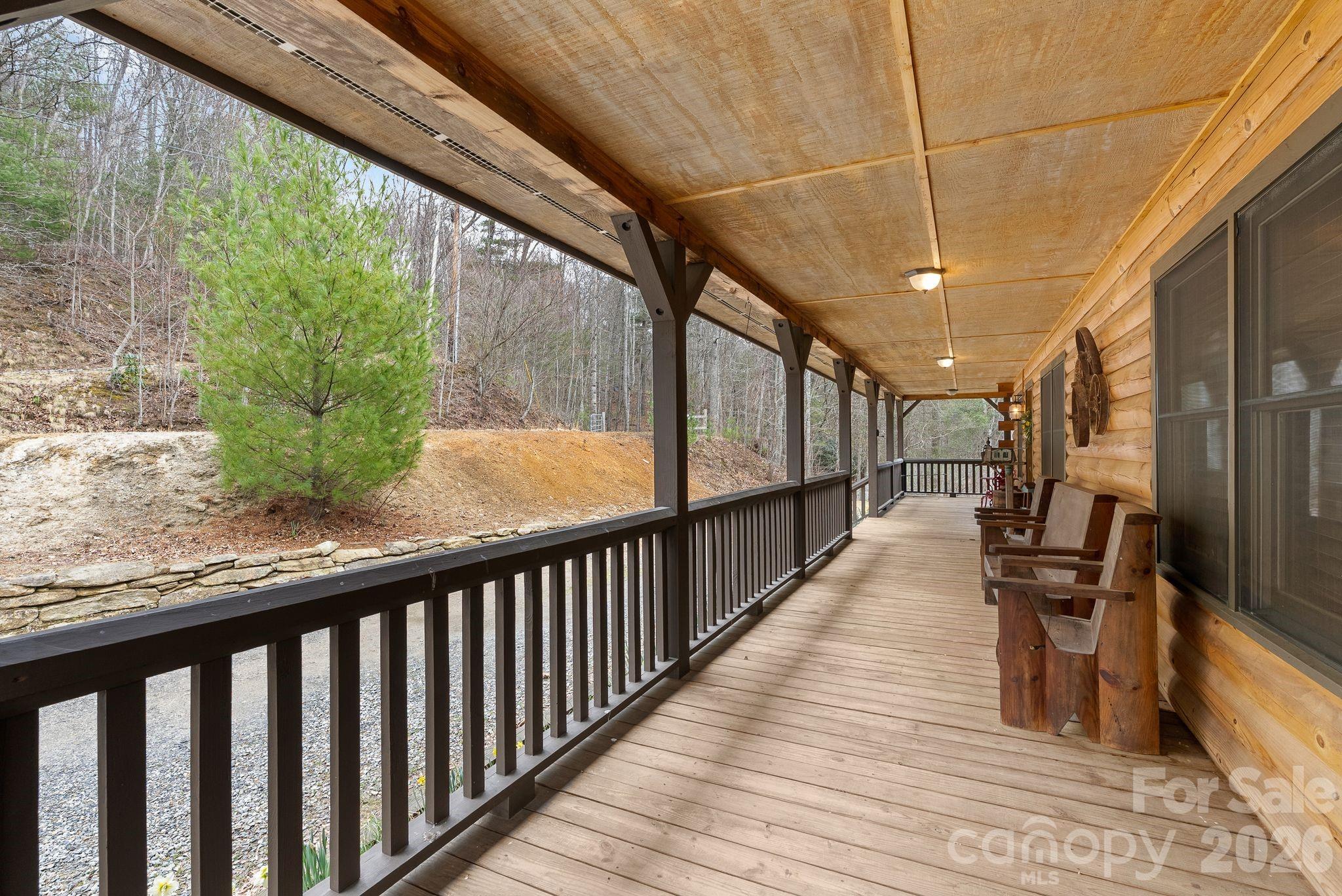 264 Moonbeam Lane Clyde, NC 28721 - Photo 3 of 46 a view of a porch with wooden floor