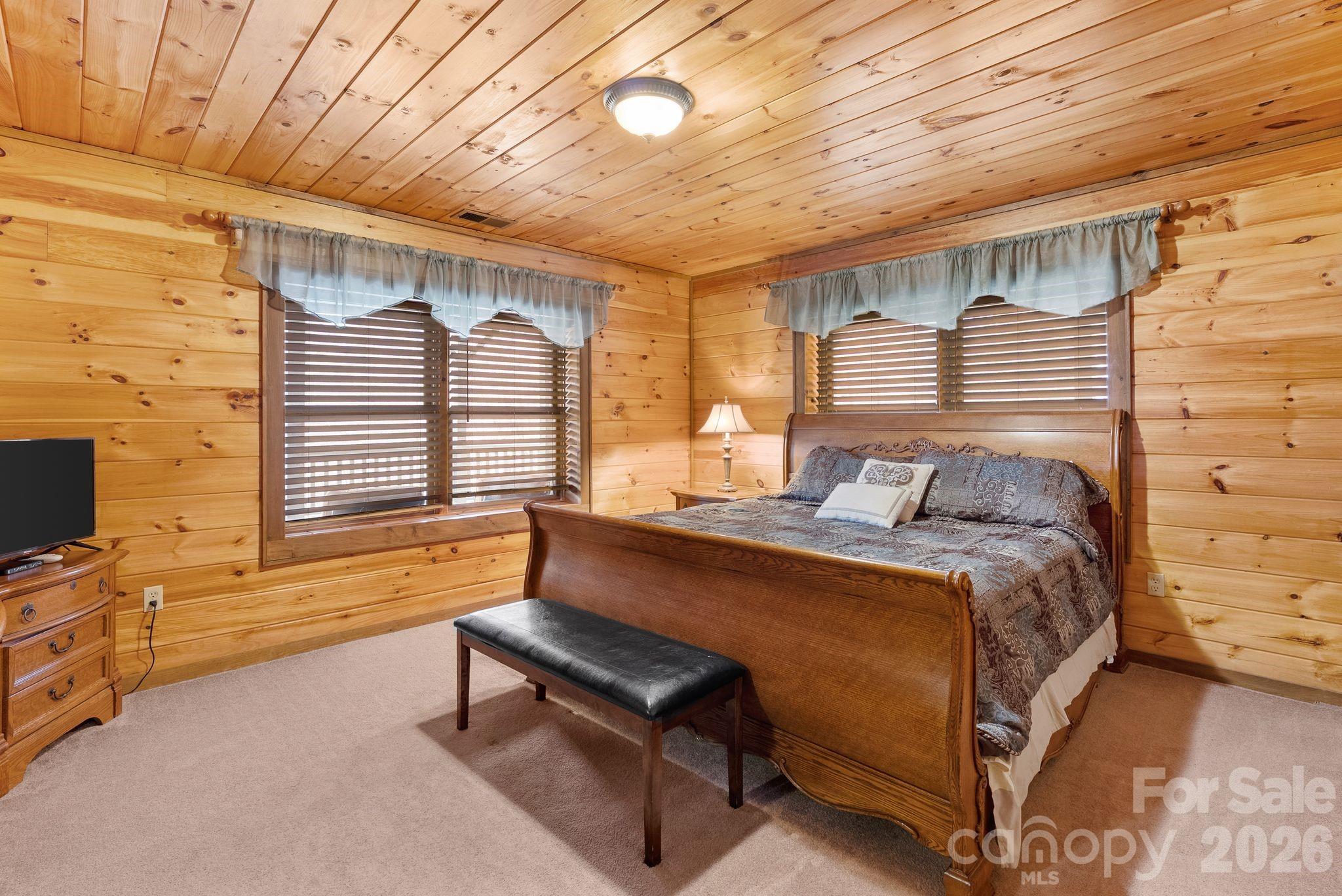 264 Moonbeam Lane Clyde, NC 28721 - Photo 32 of 46 a bedroom with furniture and windows