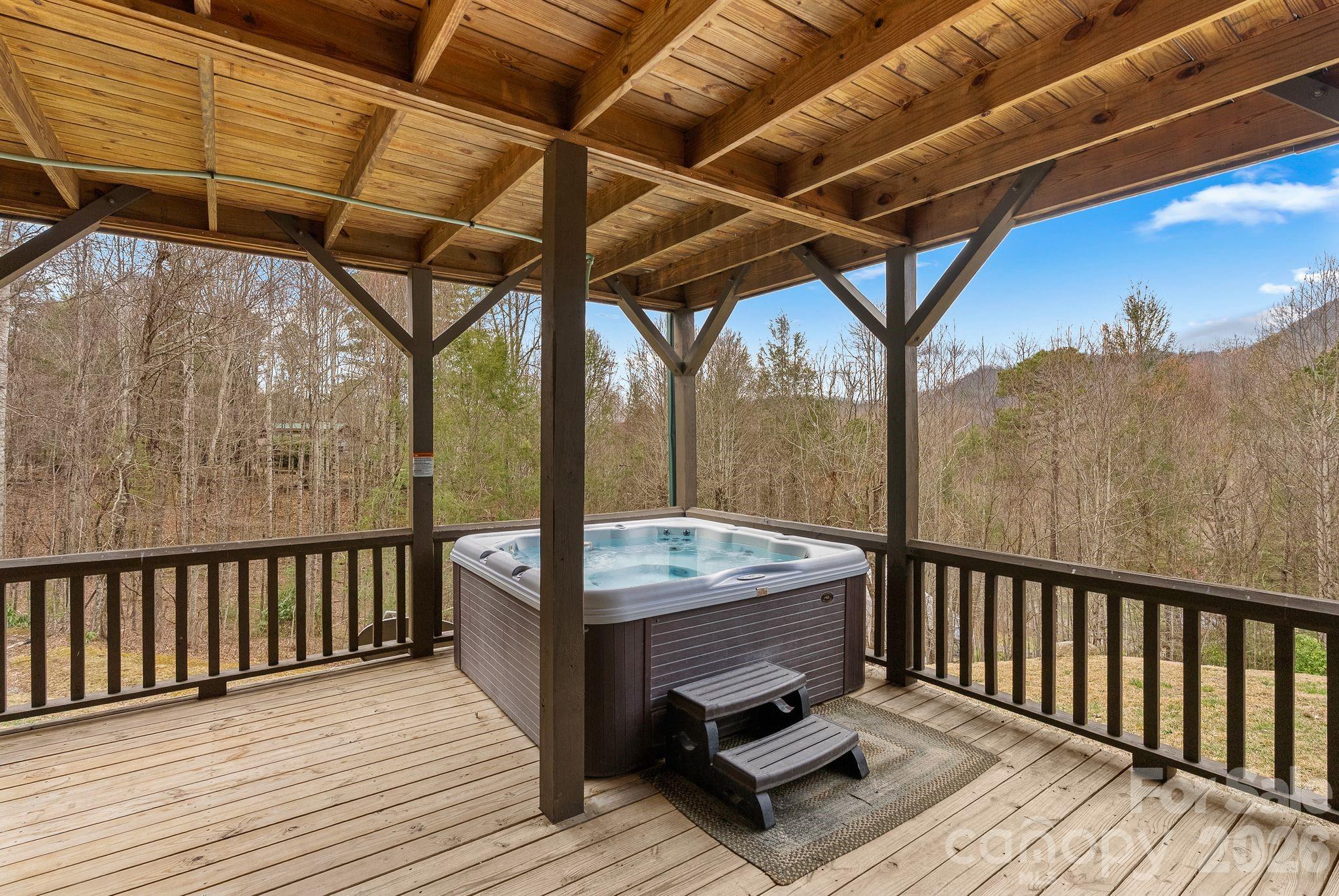 264 Moonbeam Lane Clyde, NC 28721 - Photo 33 of 46 a balcony with furniture and wooden floor