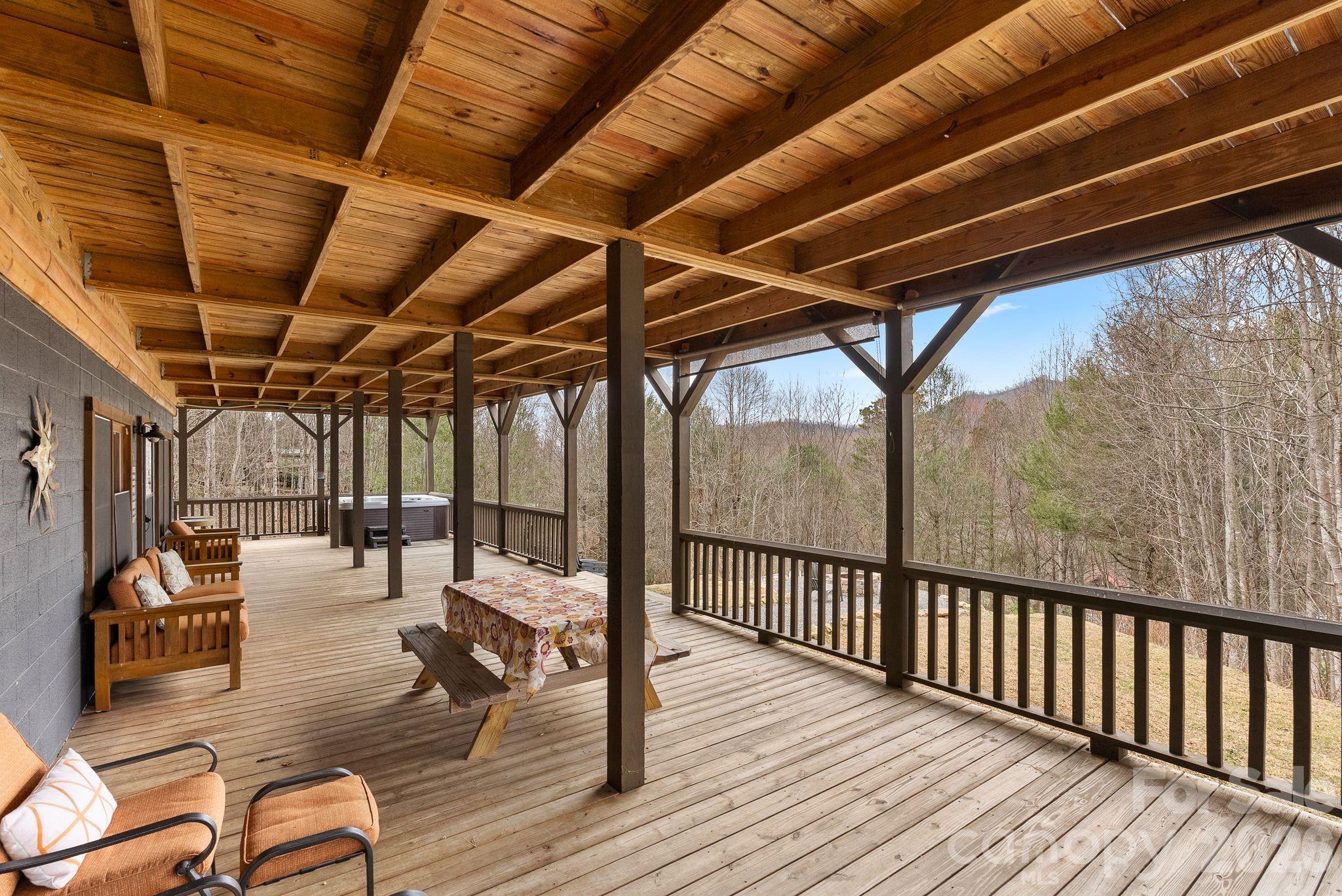 264 Moonbeam Lane Clyde, NC 28721 - Photo 34 of 46 a view of a patio with wooden floor