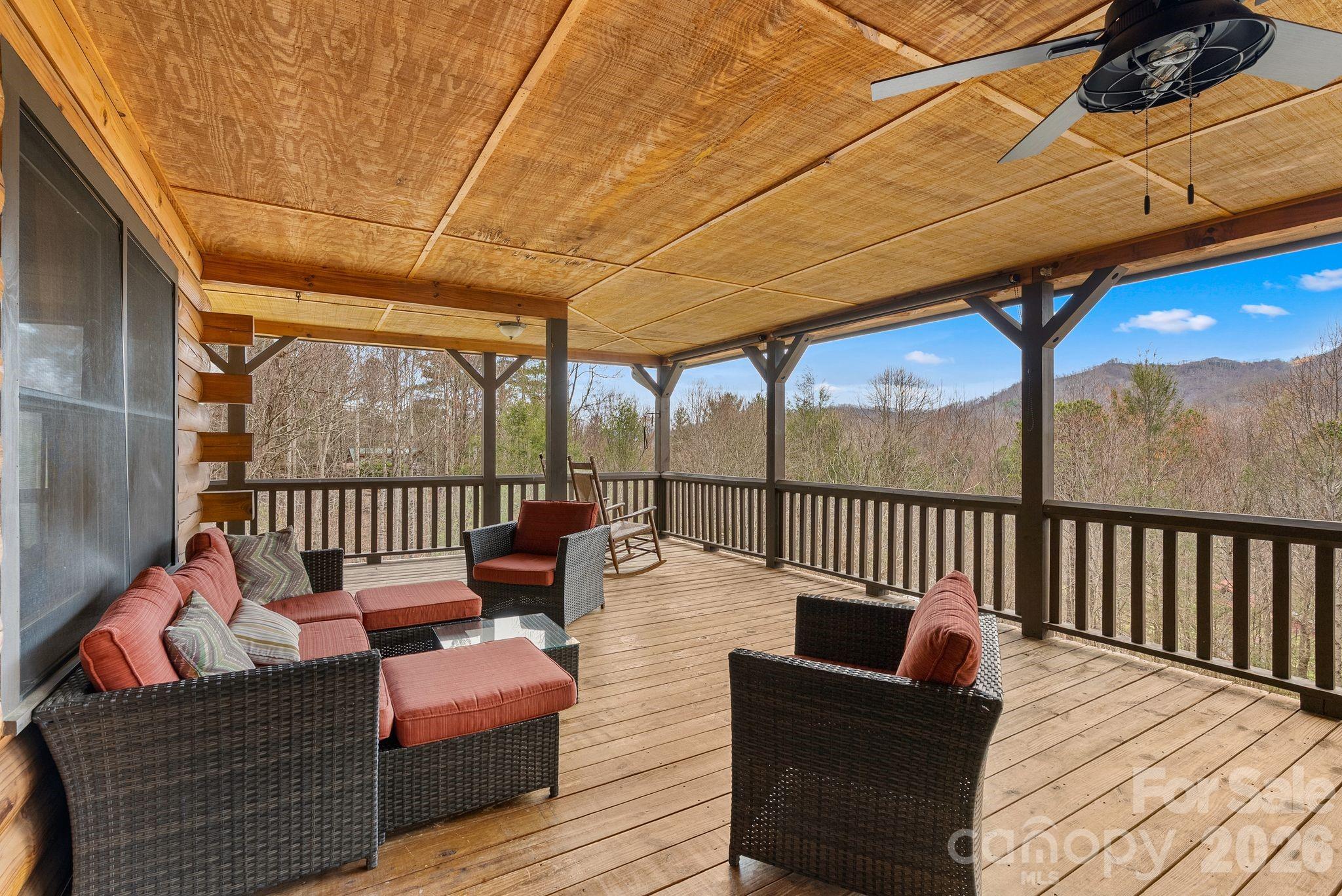 264 Moonbeam Lane Clyde, NC 28721 - Photo 36 of 46 a balcony with furniture and wooden floor