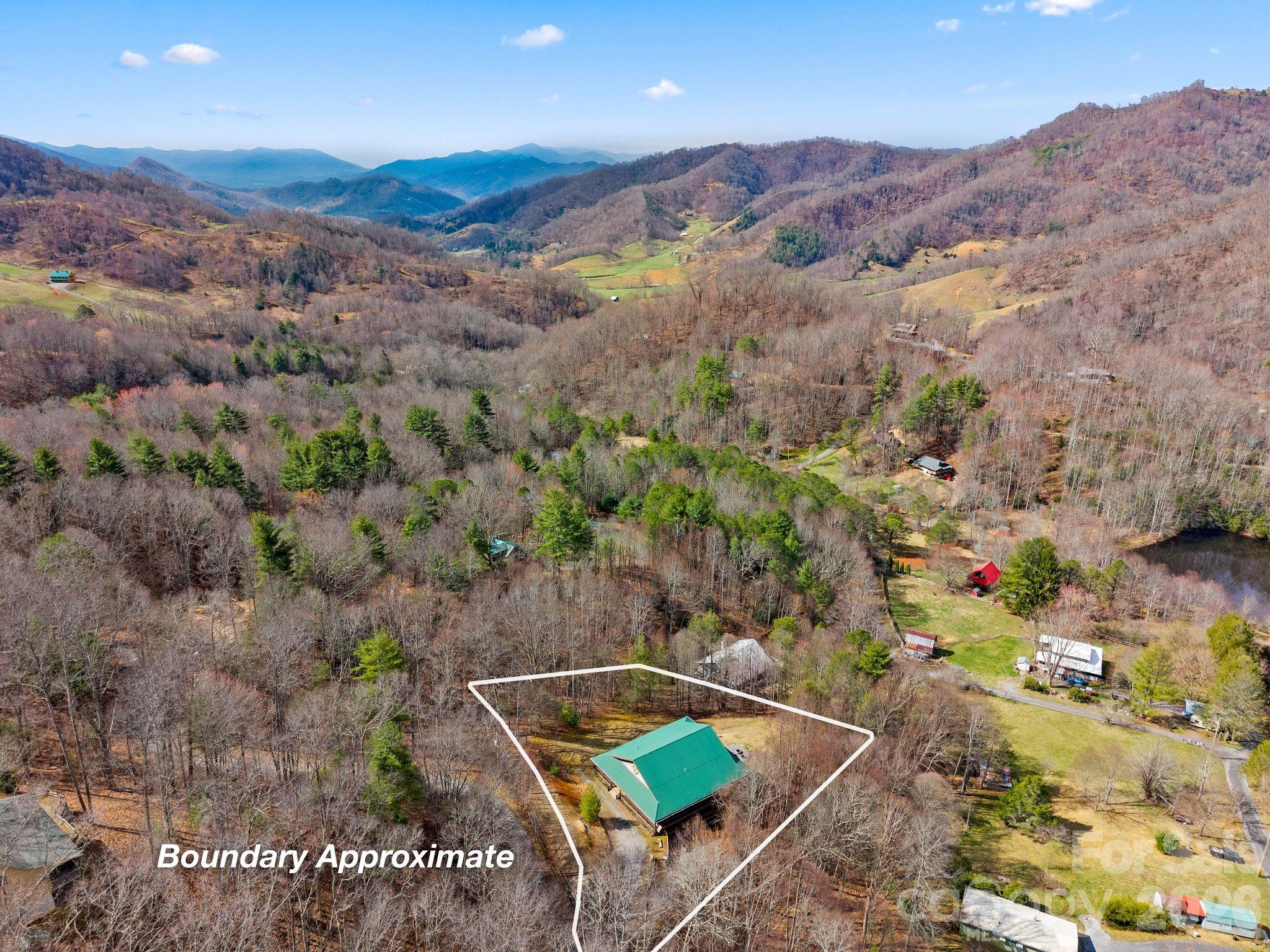 264 Moonbeam Lane Clyde, NC 28721 - Photo 42 of 46 an aerial view of a house with a yard