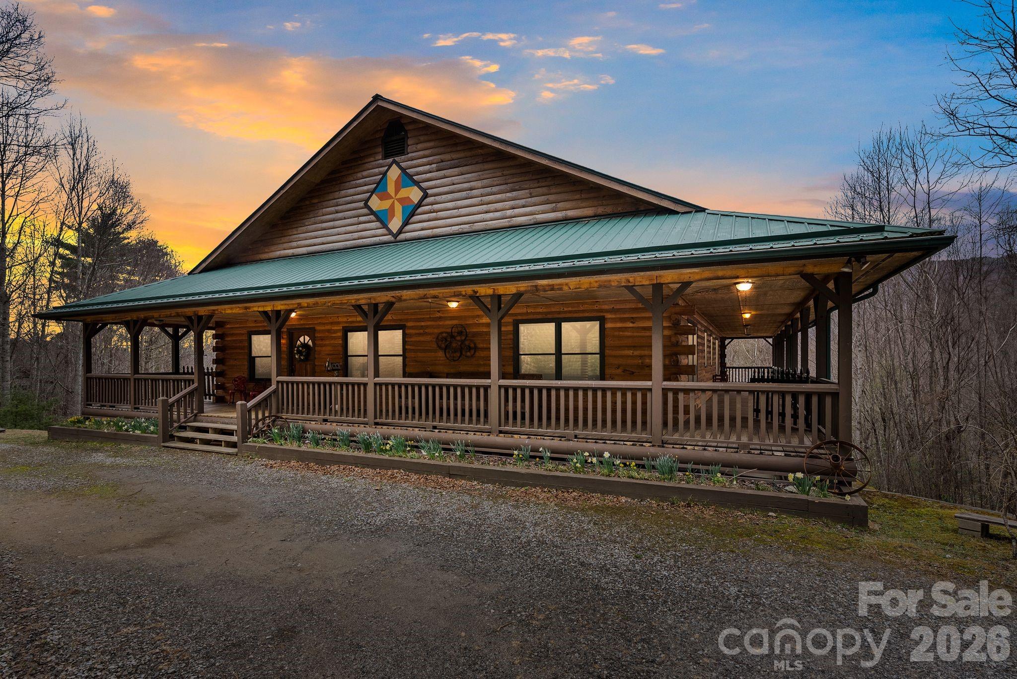 264 Moonbeam Lane Clyde, NC 28721 - Photo 45 of 46 a view of wooden house with a yard