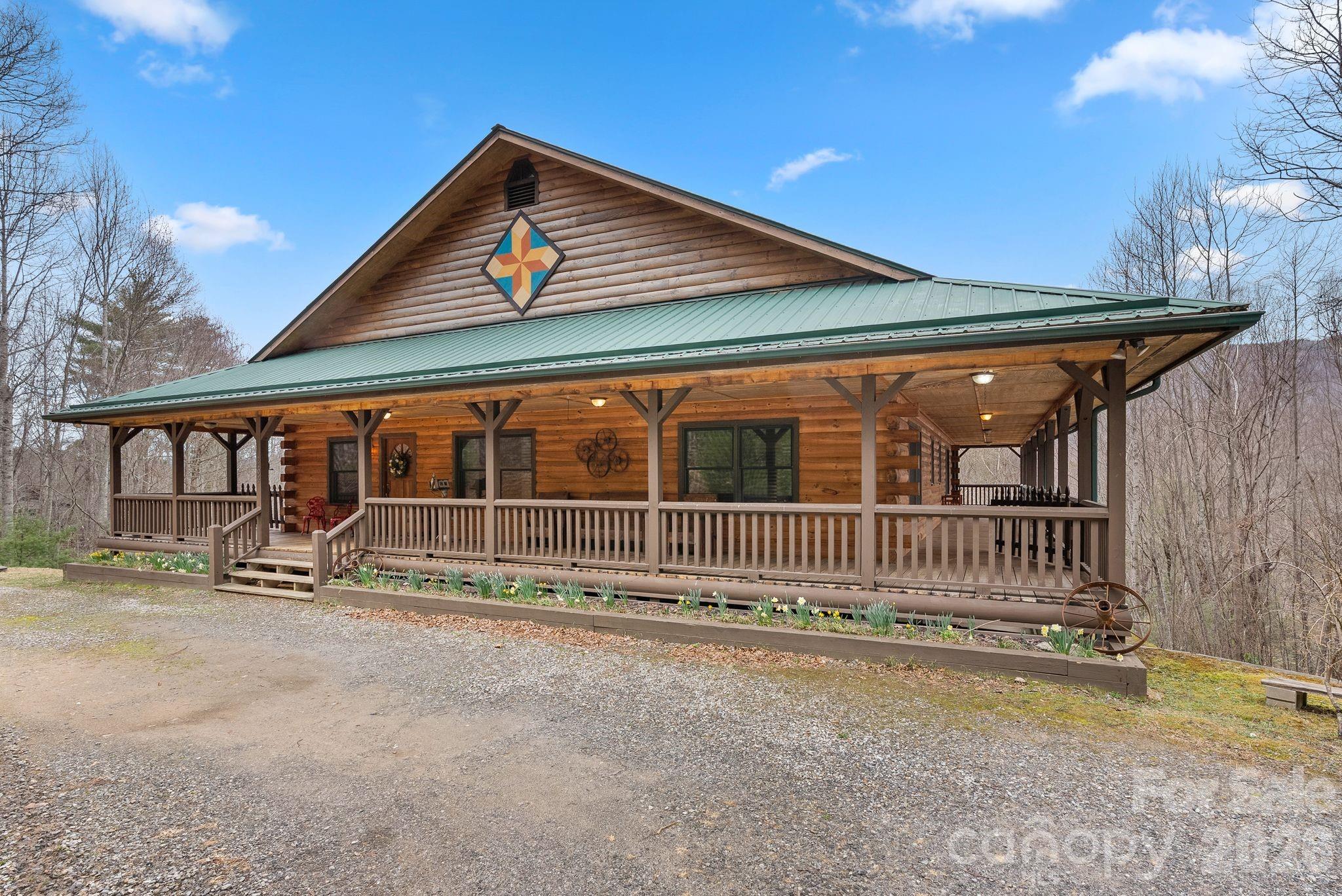 264 Moonbeam Lane Clyde, NC 28721 - Photo 46 of 46 a view of a house with wooden floor and a yard