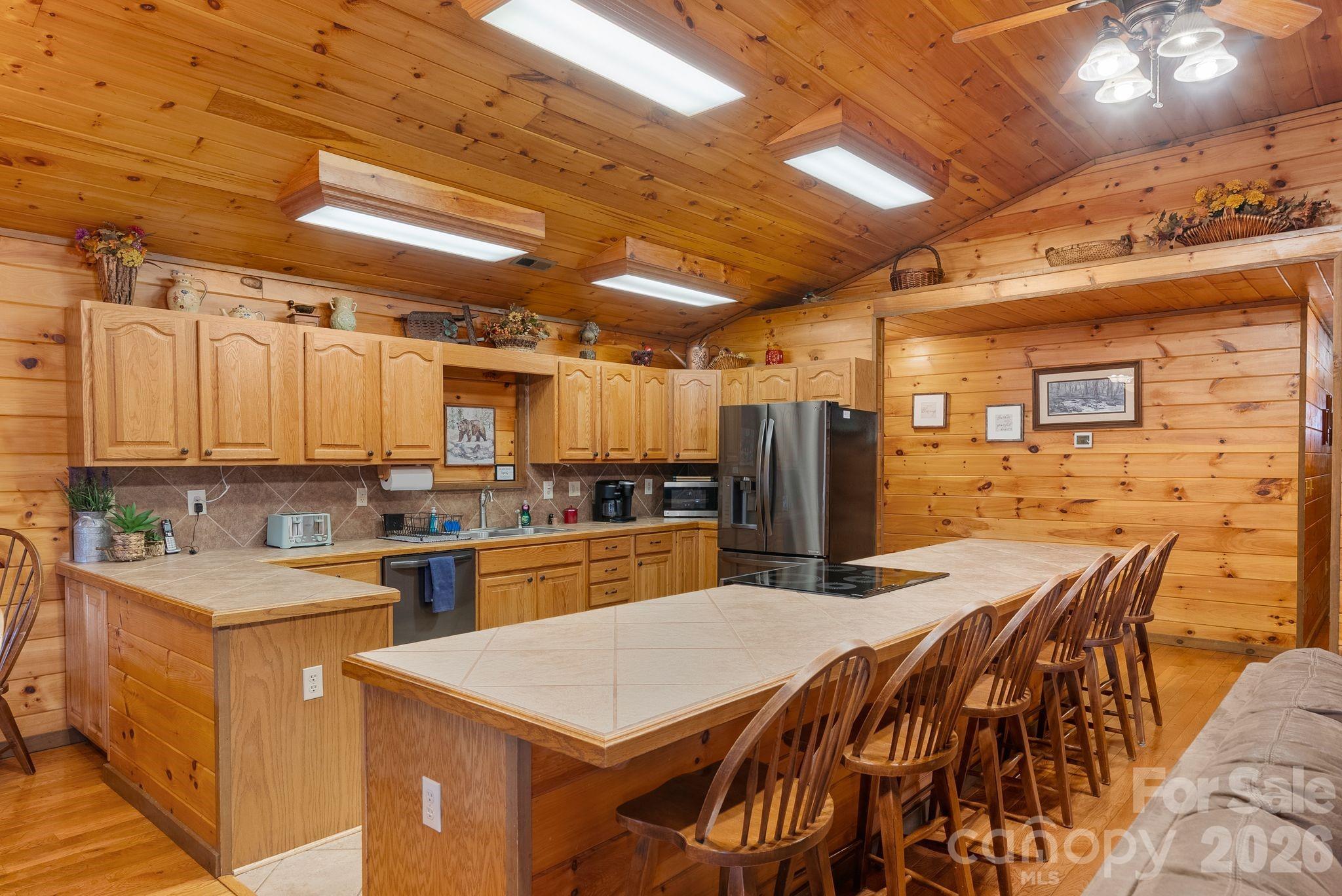 264 Moonbeam Lane Clyde, NC 28721 - Photo 8 of 46 a kitchen with lots of counter top space and refrigerator