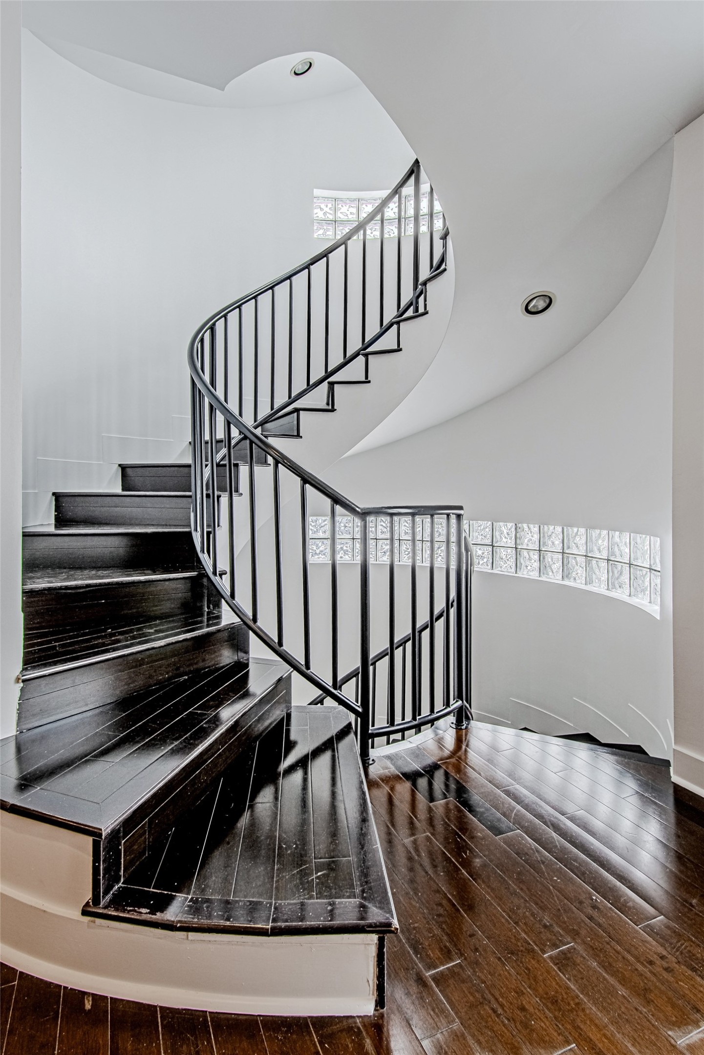 2025 Colquitt Street, Unit E Houston, TX 77098 - Photo 15 of 29 Another angle of the staircase highlighting its elegant curves and modern design.