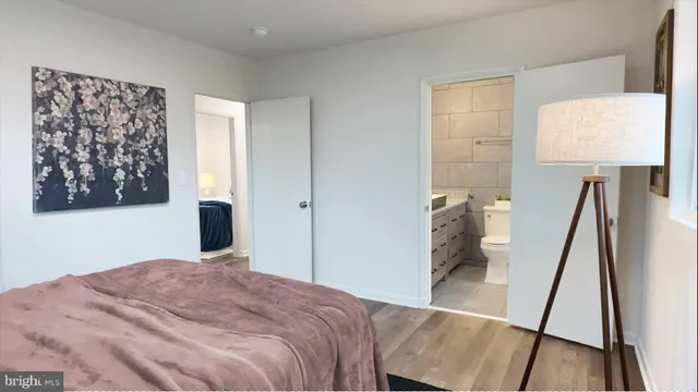 a bedroom with a bed and a dresser