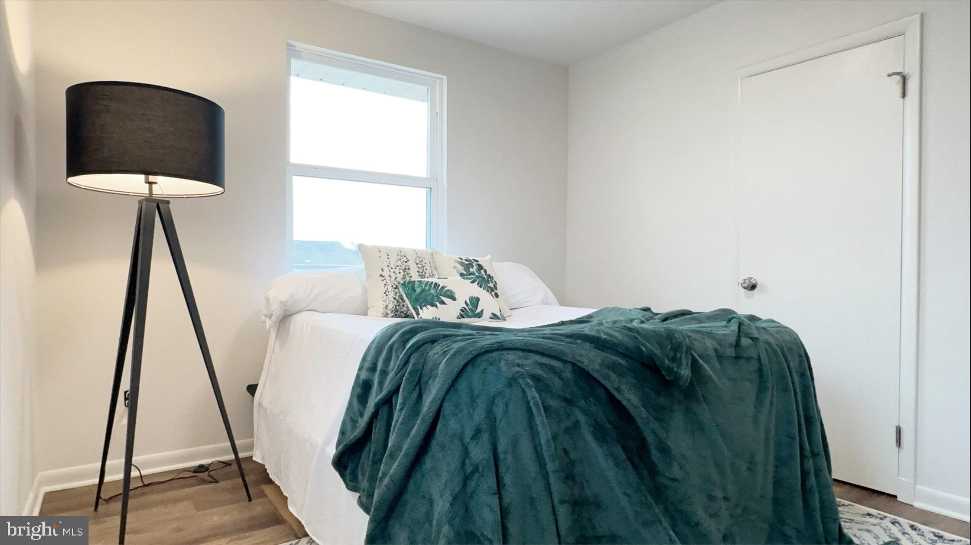 8802 Ashford Road Parkville, MD 21234 - Photo 20 of 39 a bedroom with a bed and a window