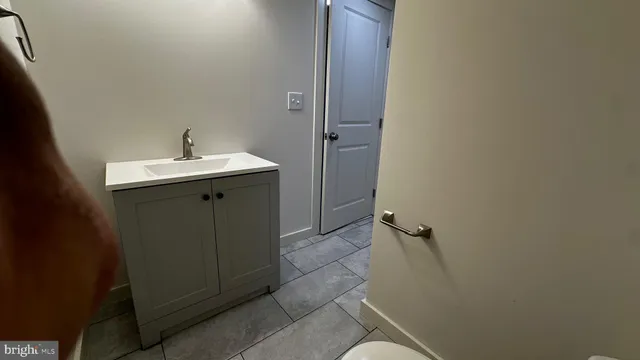 a bathroom with a sink and mirror