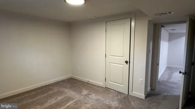 an entryway and a livingroom with furniture