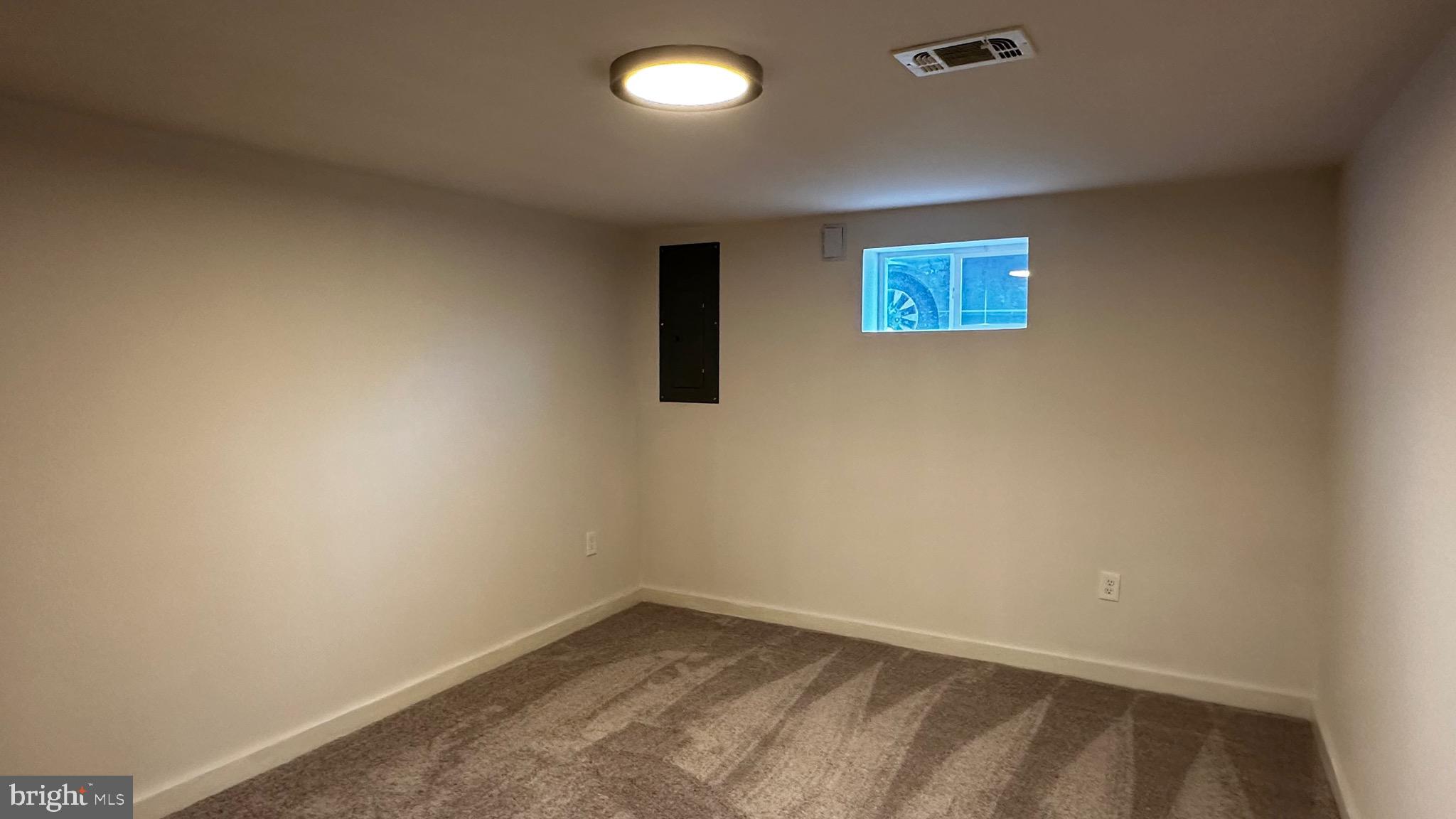 8802 Ashford Road Parkville, MD 21234 - Photo 37 of 39 an empty room with a window