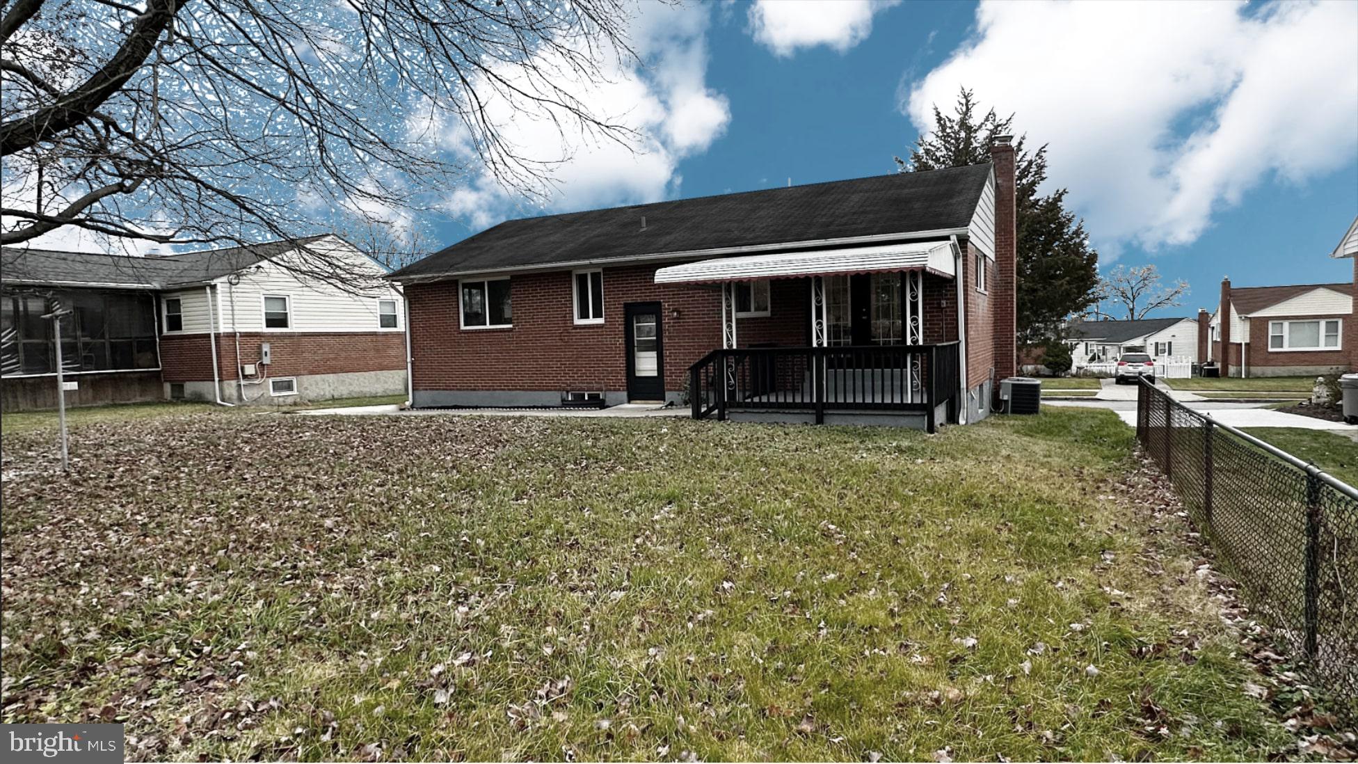 8802 Ashford Road Parkville, MD 21234 - Photo 38 of 39 a view of a house with a yard and garage