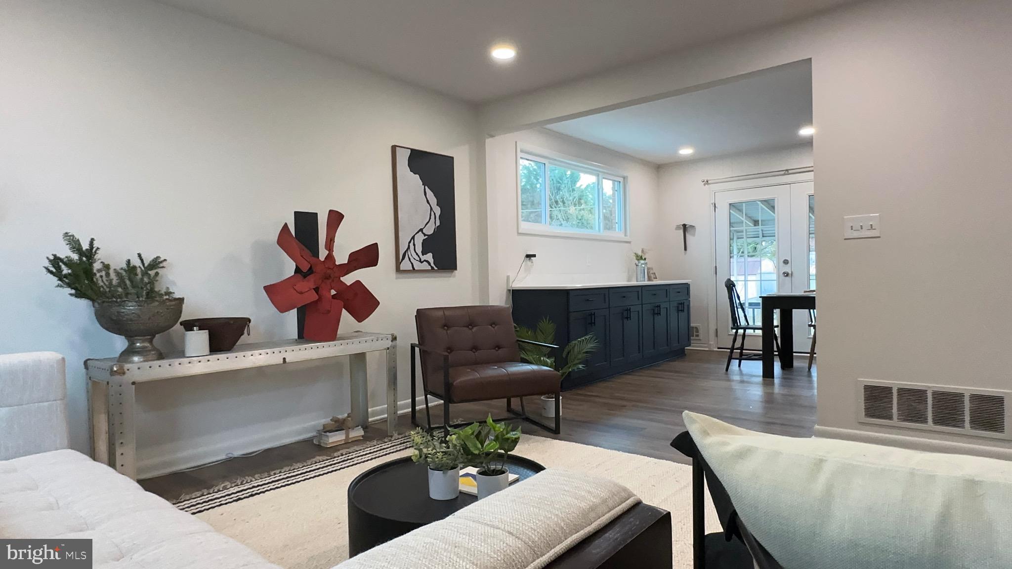 8802 Ashford Road Parkville, MD 21234 - Photo 7 of 39 a living room with furniture and a wooden floor