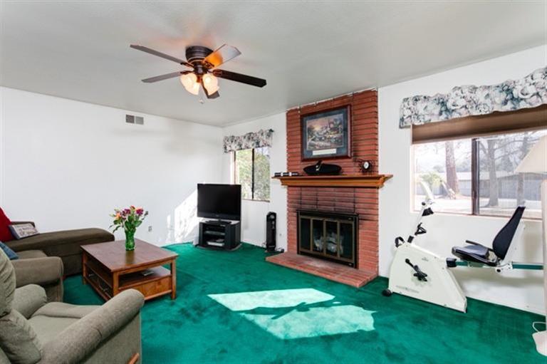 985 Spring Street Oak View, CA 93022 - Photo 3 of 15 a living room with furniture fireplace and window