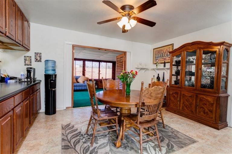 985 Spring Street Oak View, CA 93022 - Photo 5 of 15 a view of a dining room with furniture and a chandelier fan