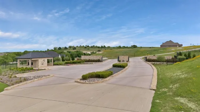 an aerial view of a house with a garden and trees