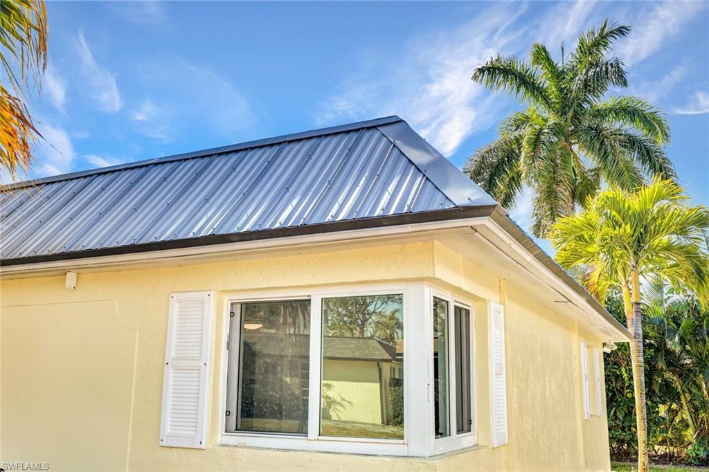20 Kings Road, Unit A18 Naples, FL 34112 - Photo 19 of 19 a view of a house with a swimming pool