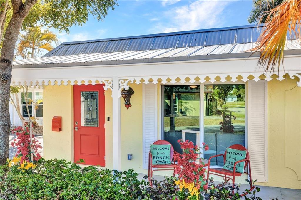 20 Kings Road, Unit A18 Naples, FL 34112 - Photo 2 of 19 front view of a building with a fountain