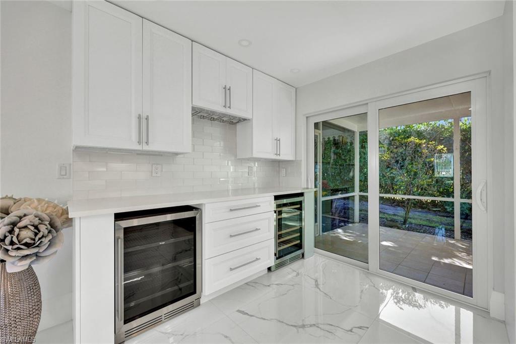 20 Kings Road, Unit A18 Naples, FL 34112 - Photo 10 of 19 a kitchen with granite countertop a stove and a sink