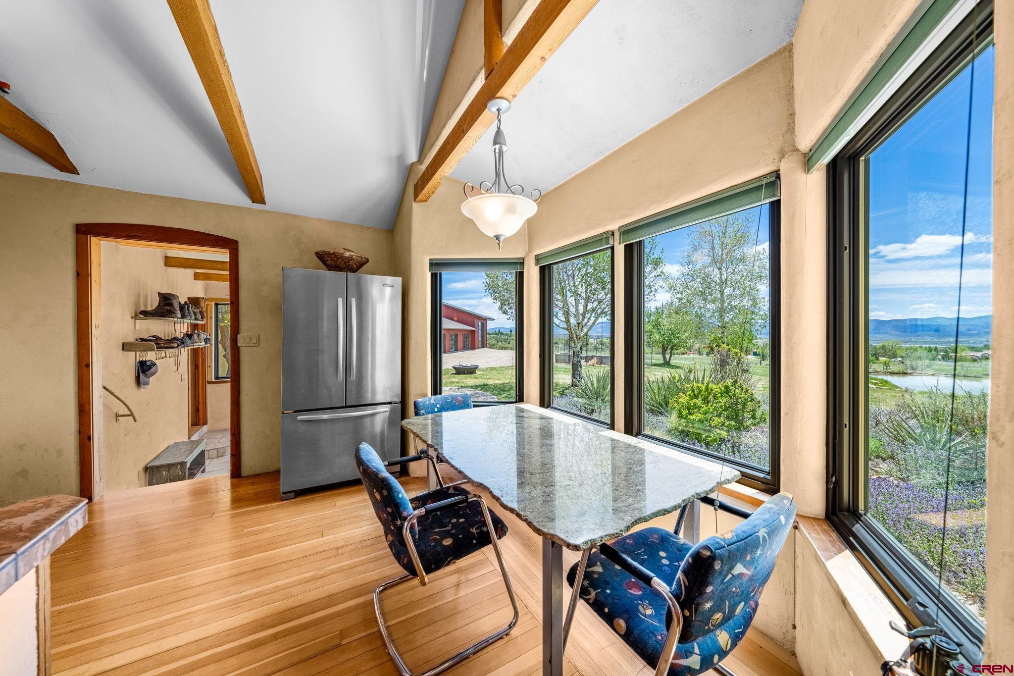 27778 Rd P Dolores, CO 81323 - Photo 20 of 45 a dining room with furniture and wooden floor