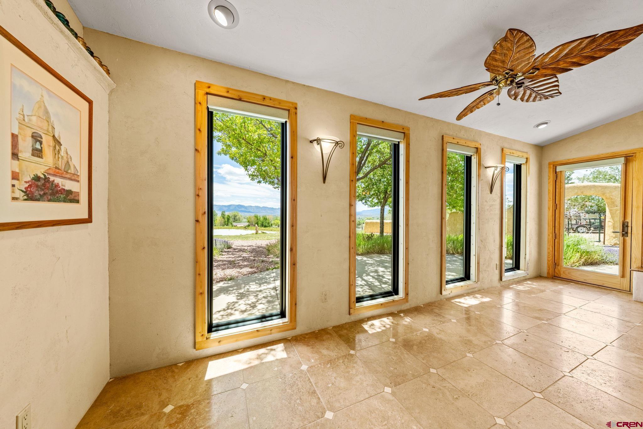 27778 Rd P Dolores, CO 81323 - Photo 24 of 45 a view of a big room with windows chandelier and front door