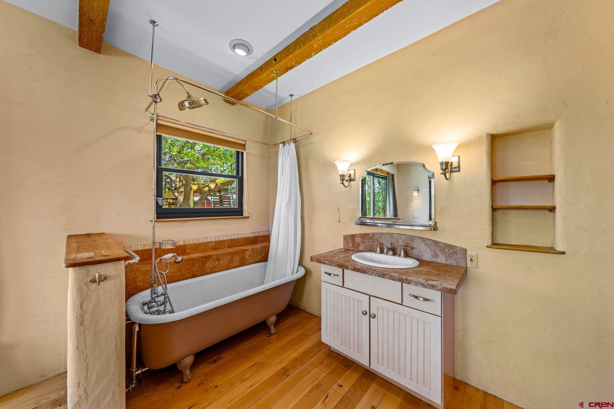 27778 Rd P Dolores, CO 81323 - Photo 31 of 45 a bathroom with a sink a mirror and a bathtub