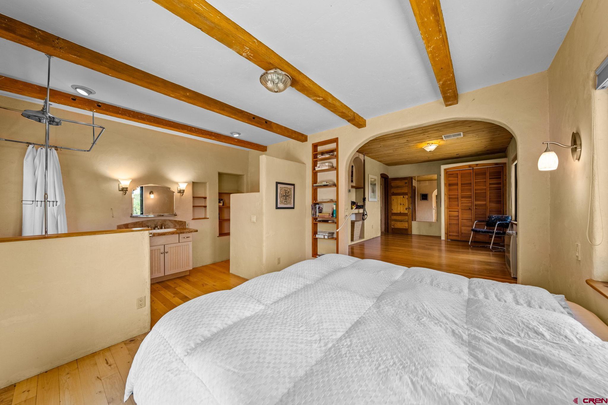 27778 Rd P Dolores, CO 81323 - Photo 31 of 45 a bedroom with a bed and a large mirror on the dresser