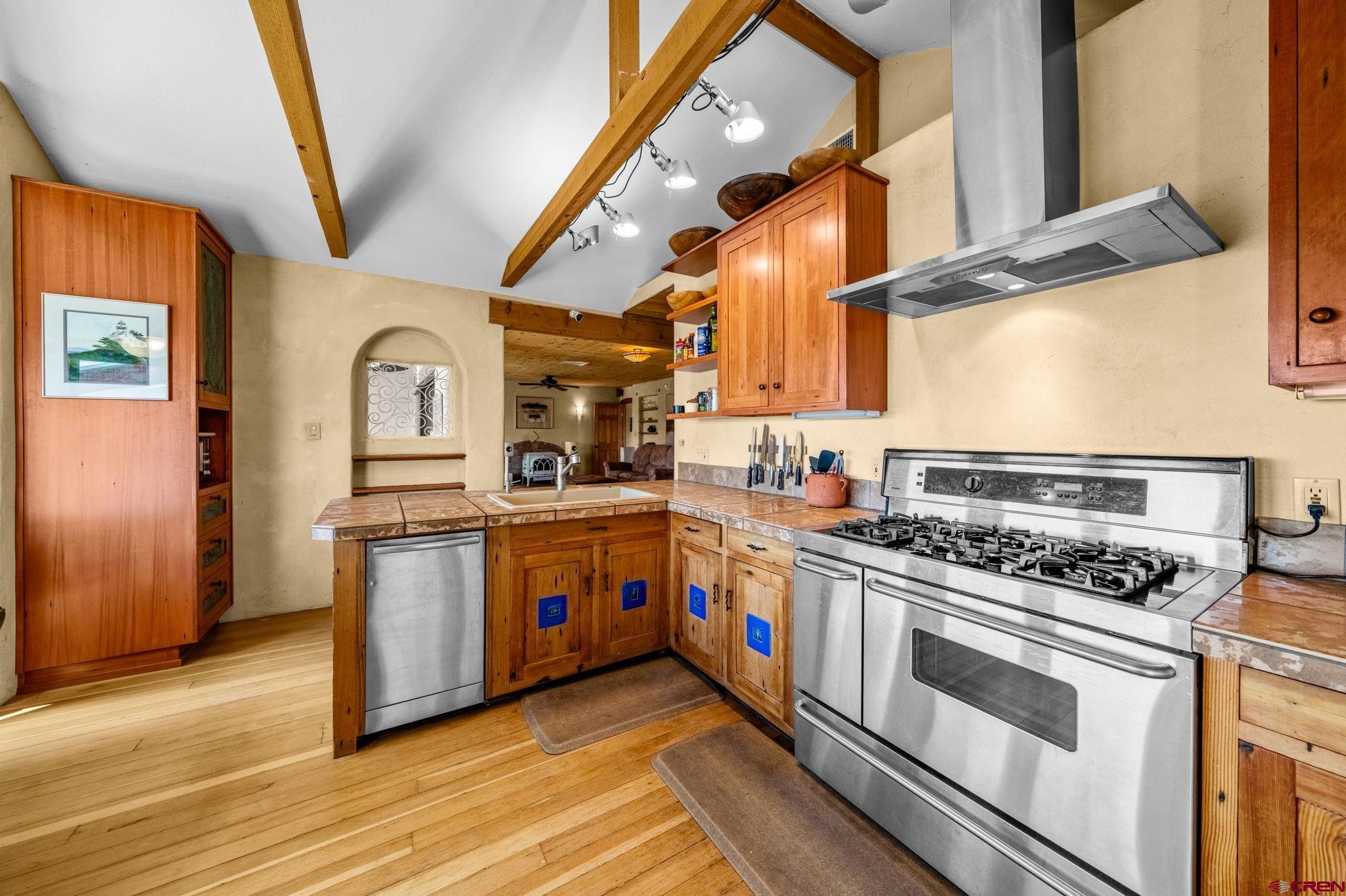 27778 Rd P Dolores, CO 81323 - Photo 38 of 45 a kitchen with stainless steel appliances a stove a sink and a refrigerator