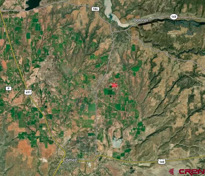 27778 Rd P Dolores, CO 81323 - Photo 41 of 45 a backyard of a house with lots of green space