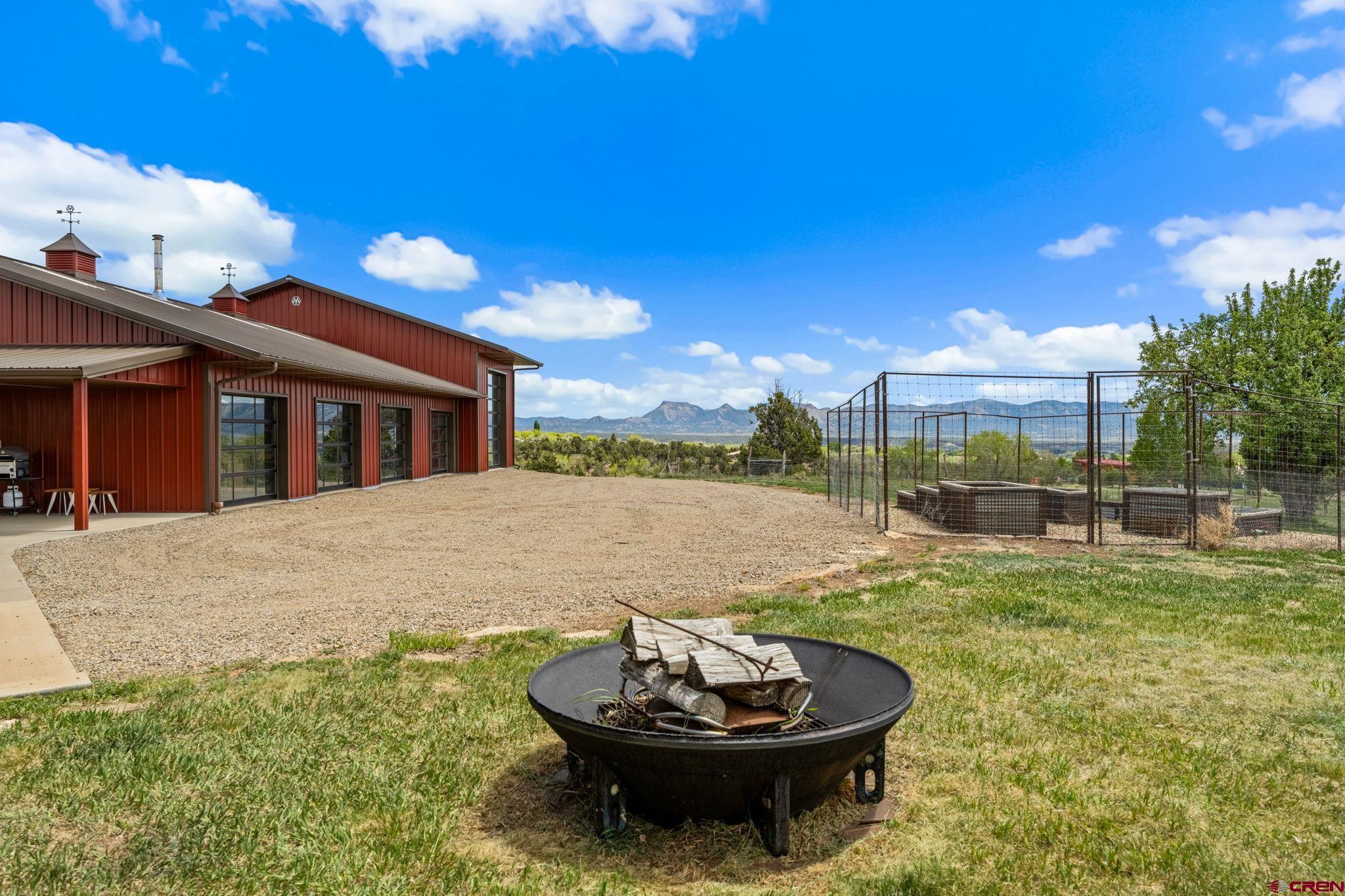27778 Rd P Dolores, CO 81323 - Photo 7 of 45 a view of a white house with a swimming pool and a yard